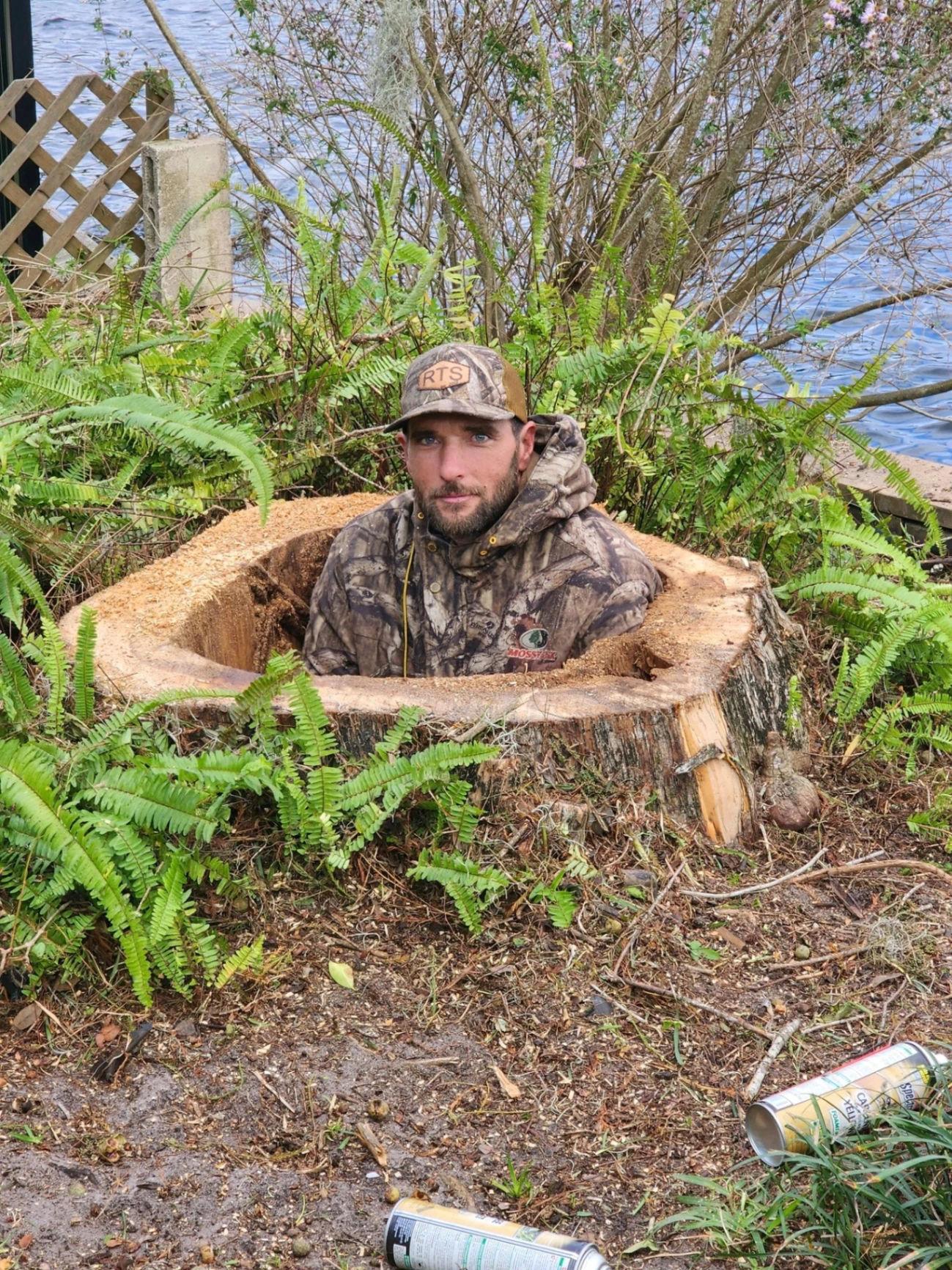 Crew member showing off a massive freshly cut stump